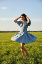 Denim puff sleeve dress with fit and flare style from Thread Bar Boutique swing style