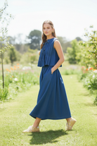 High-waisted denim maxi skirt from Thread Bar Boutique, featuring elastic waistband, flounce detail, and part of a coordinated set