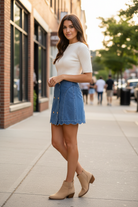 Denim skirt with scallop trim hem and button front closure in relaxed fit