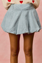 Casual and chic bubble mini skirt in light denim from Thread Bar Boutique, mini length with structured fit for effortless style
