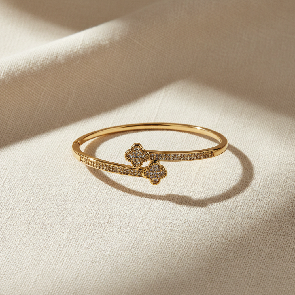 Double clover cubic zirconia bangle bracelet in polished stainless steel with hinged closure