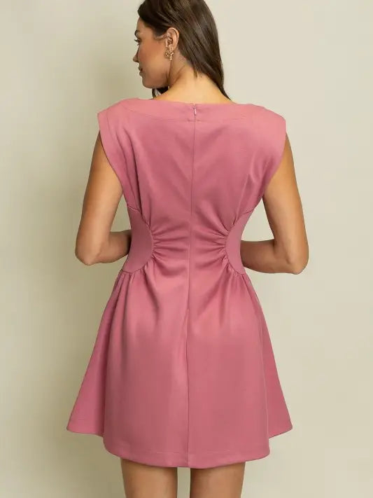Mauve pink sleeveless mini dress with side cutouts, ruched waist detail, and flared skirt rear view