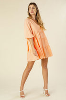 A charming gingham tiered dress featuring a V-neckline, puff 3/4 sleeves, and a flowy tiered silhouette. Fully lined with no stretch, perfect for casual outings, picnics, or brunch dates.