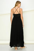 Model wearing an elegant lace maxi dress with a bustier-style bodice and flowing skirt, styled for a romantic formal occasion.