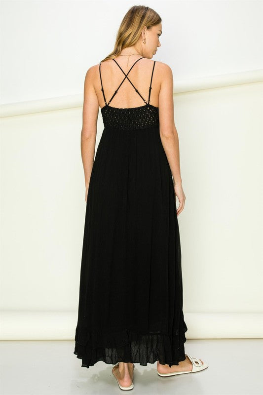 Model wearing an elegant lace maxi dress with a bustier-style bodice and flowing skirt, styled for a romantic formal occasion.