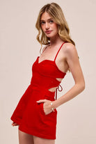 Fitted Game Day romper with lace-up open back design