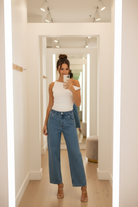 Fitted off-shoulder top with asymmetrical design, soft stretchy nylon blend, and sleek modern look