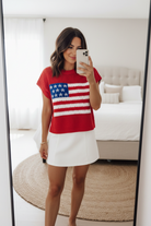 Red American flag graphic knit top with relaxed fit and short sleeves