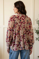 Floral blouse back view showing pleated yoke