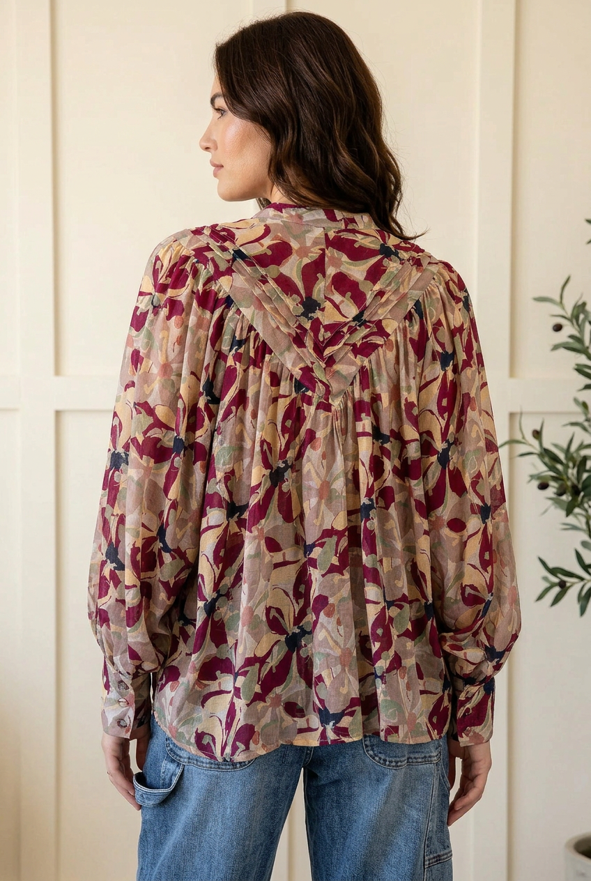 Floral blouse back view showing pleated yoke