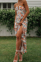 Thread Bar Boutique halter neck midi dress with ruched bodice, tie back, and concealed zipper with front slit