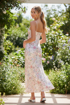 Feminine floral maxi dress from Thread Bar Boutique with slip silhouette, adjustable straps, and flowy fit back view adjustable straps