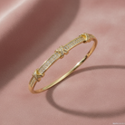 Cubic Zirconia Stainless Steel Bangle flatlay on dusty rose velvet background