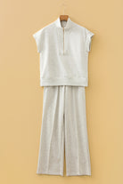 Flat lay of grey half zip polo tee and coordinating pants set