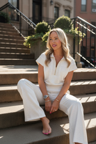 Side view of grey wide leg pants and half zip polo set with relaxed fit