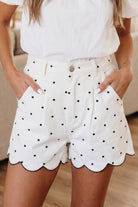 White shorts with black polka dots high waist scallop hem
