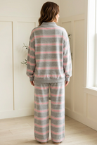 Back view of the Slow Morning Pink Stripe lounge set featuring a relaxed dropped shoulder pullover and wide leg pants.