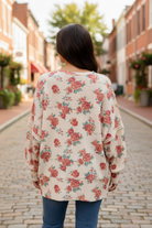 Floral waffle thermal sweatshirt back view showing exposed seam detailing on sleeves and back, oversized relaxed fit, rose floral print on oatmeal knit