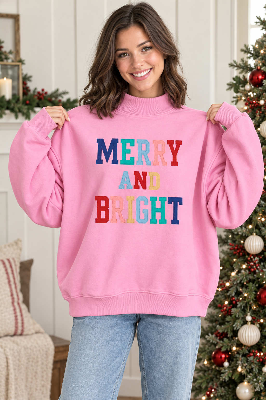Pink Merry and Bright pullover showing roomy fit, dropped shoulders and long sleeves