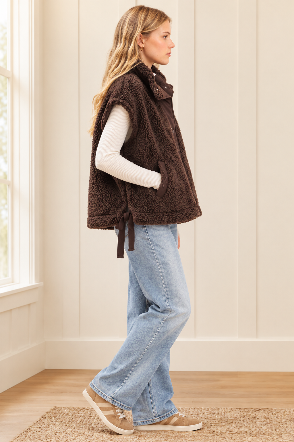Brown sherpa vest, side view showing adjustable bow ties