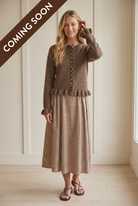 Brown button front cardigan with wavy ruffle trim along the placket, long sleeves, and a gathered ruffle hem.