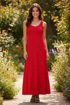 Red wide strap maxi tank dress full length front — brunette model standing in garden patio with black strappy heels