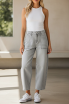 Close-up front detail of RISEN light grey cropped barrel jeans with patch pockets and contrast stitching, relaxed slouchy fit women's boutique denim available at Thread Bar Boutique