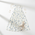 White Blue Floral Strapless Midi Dress styled flat lay with accessories from Thread Bar Boutique