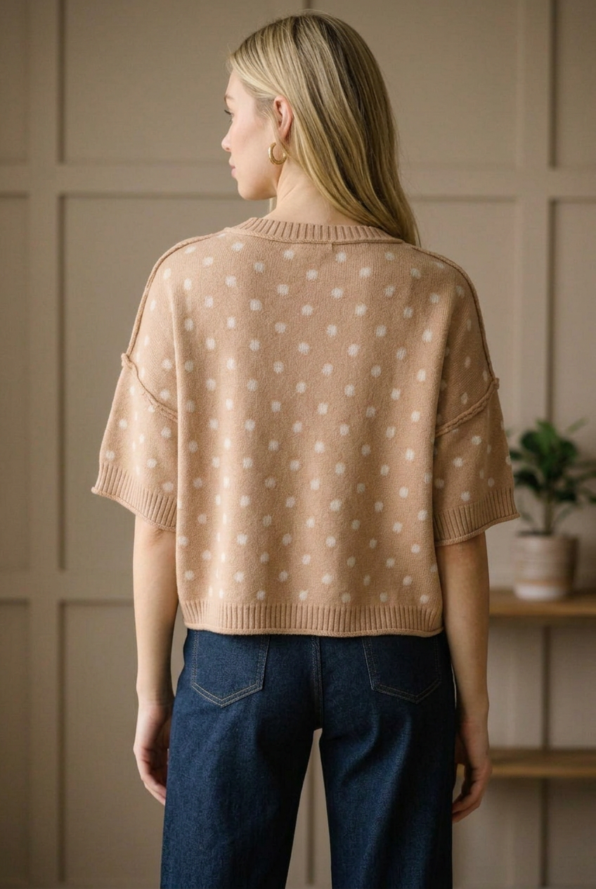 Back view of a camel polka dot knit sweater top with a ribbed crew neckline and hip length ribbed hem