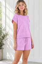 Three-quarter view of lavender lounge set with short dolman sleeves, matching drawstring shorts and washed fabric