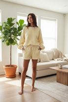 Butter yellow and white gingham cozy chic women's lounge set in lifestyle setting