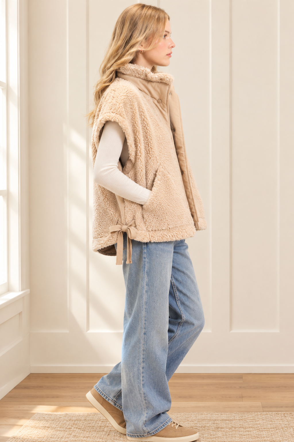 Beige sherpa vest, side view showing adjustable bow ties