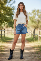 Thread Bar Boutique high rise medium wash denim shorts with front patch pockets and relaxed fit women’s boutique summer shorts.