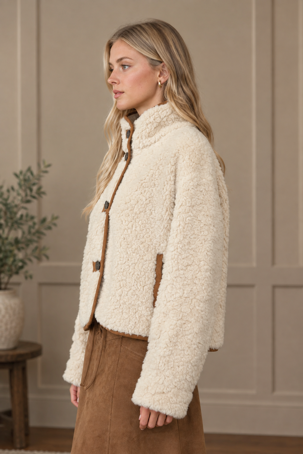 Long sleeve ivory sherpa jacket with mock neckline and brown suede trim from Thread Bar Boutique