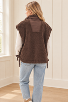 Brown high collar sherpa vest, back view showing boxy silhouette