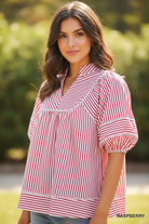 Close-up detail of Umgee raspberry striped puff sleeve babydoll top showing V-notch collar, contrast trim yoke seam, and elasticated puff sleeves