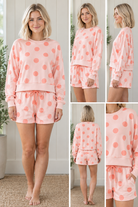 Front view of pink polka dot lounge set with coral dots, relaxed long sleeve pullover and matching drawstring shorts