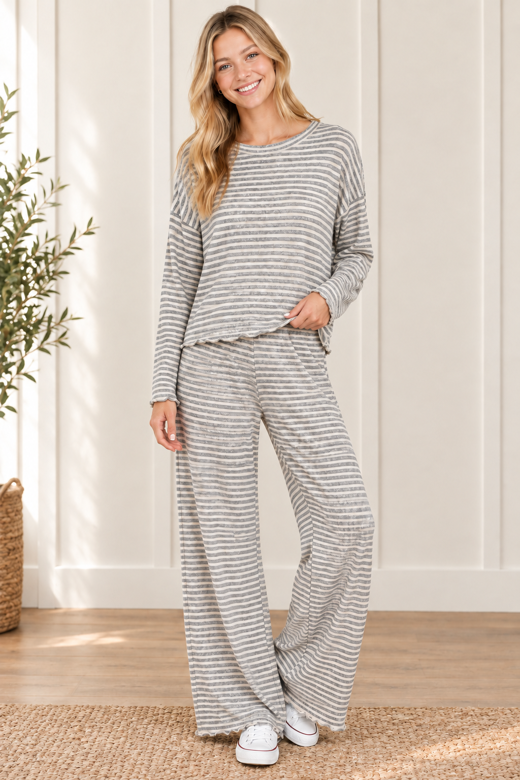 Cloud Cozy gray and ivory striped matching lounge set styled with white sneakers, featuring a lettuce hem top and full length wide leg pants