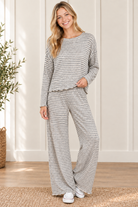 Cloud Cozy gray and ivory striped matching lounge set styled with white sneakers, featuring a lettuce hem top and full length wide leg pants
