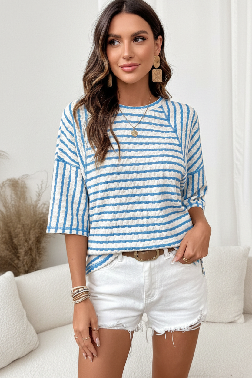 Kyla sky blue stripe textured loose top waist-up detail — crinkle fabric round neck half sleeve raglan seam close-up