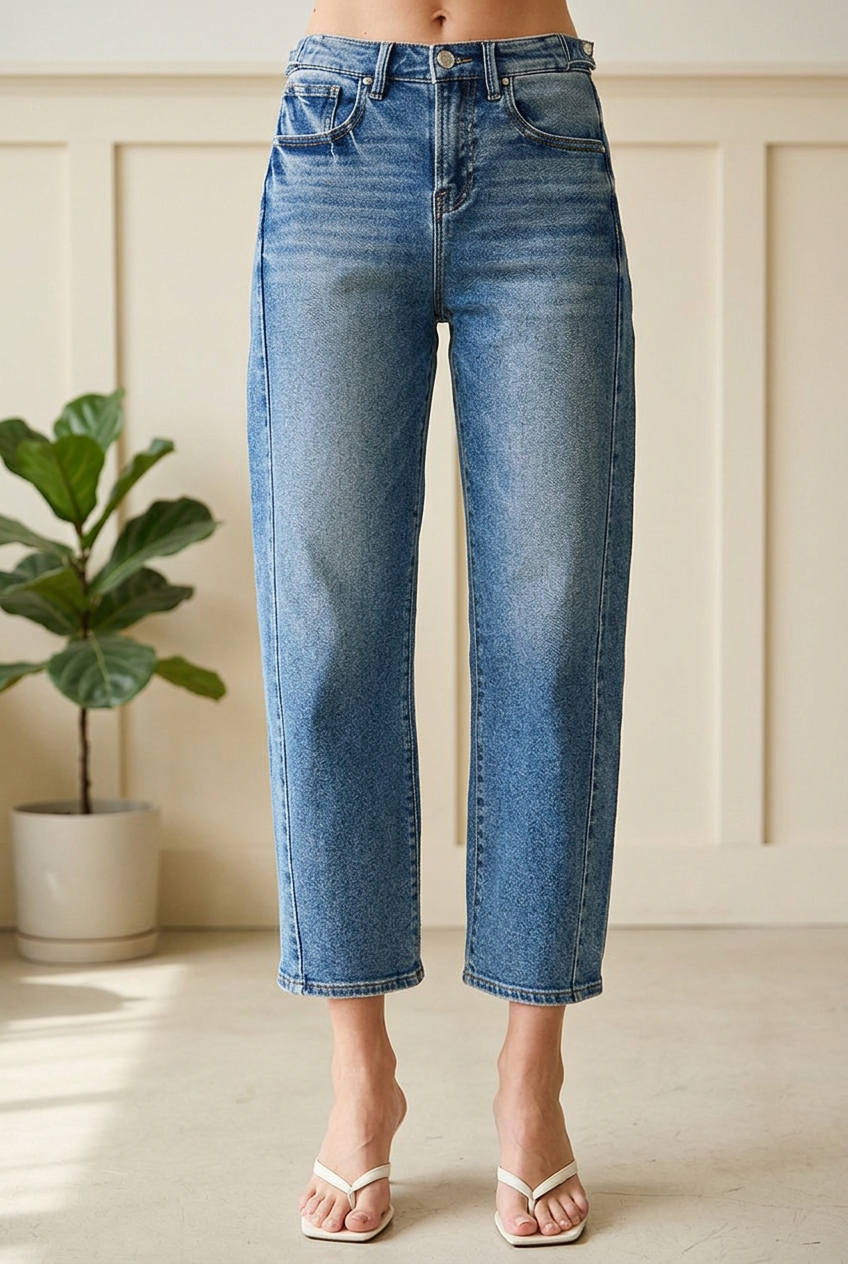 RISEN barrel jeans detail showing a button waist, belt loops, front pockets, denim whiskering and cropped hems.