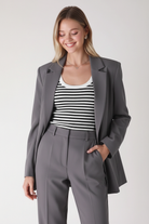 Nikibiki white black striped ribbed tank top - layered under open blazer with tailored trousers
