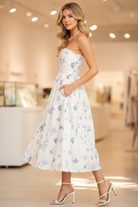 White Blue Floral Strapless Midi Dress side view with hidden pockets from Thread Bar Boutique