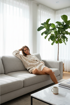 Woodland camo sweat set on couch in modern home