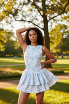 Soft blue floral active mini dress with built-in shorts outdoors