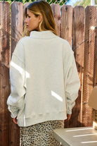 Reversible faith sweatshirt with Jesus and God Is Good text in ash grey and vintage blue back view