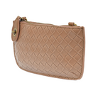 Compact woven vegan leather clutch showing the slim, travel-friendly profile and adjustable crossbody strap. chestnut color
