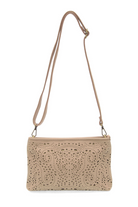 Quinn laser cut eyelet crossbody bag in soft vegan leather with adjustable shoulder strap and brass hardware. Shoulder Strap
