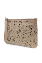 Close-up of the feminine laser cut eyelet lace pattern on the Quinn vegan leather pouch clutch.