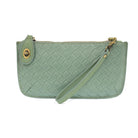 Wide-woven vegan leather 3-in-1 crossbody bag in a sophisticated textured finish with brass turn lock closure. sea foam